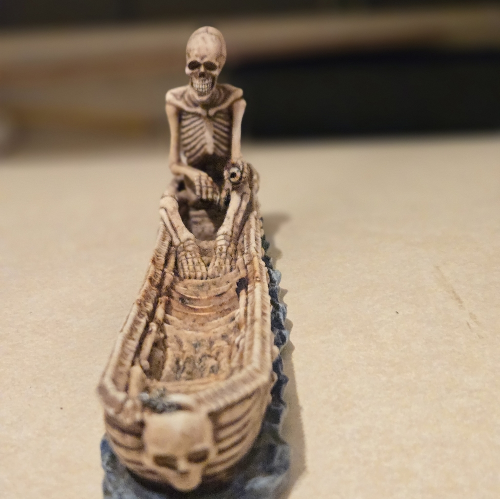Skull in boat incense burner